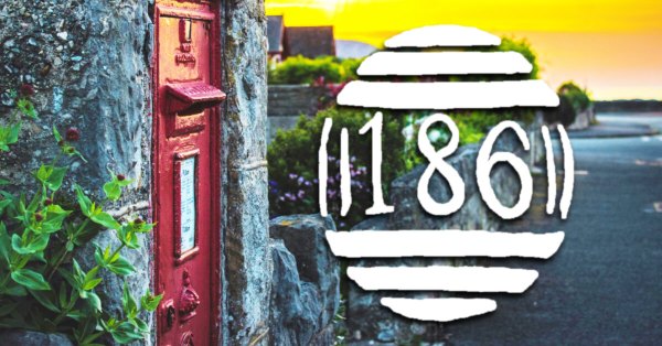 The barred numeral postmark 186 is superimposed over a photograph of an in-wall postbox lit by a setting sun