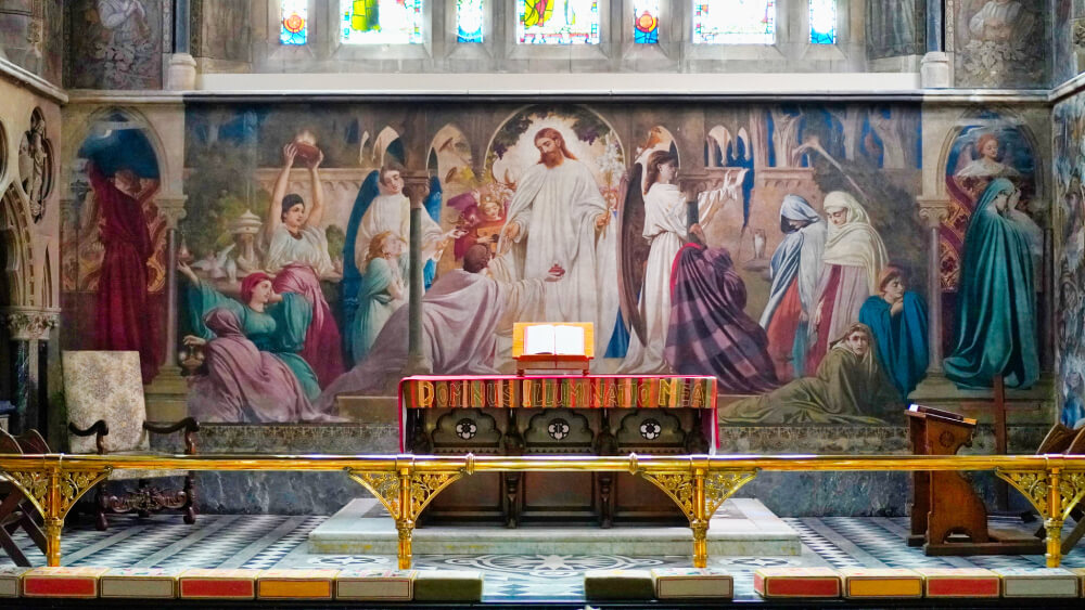 A photograph of Lord Leighton's fresco, The Wise and Foolish Virgins, at St Michael and All Angels church in Lyndhurst, Hampshire, England. It depicts the parable also known as the Ten Bridesmaids. Christ is at the centre, being attended by the five bridesmaids who brought extra oil to tend their lamps during the night, while the five who did not are lamenting their foolishness.